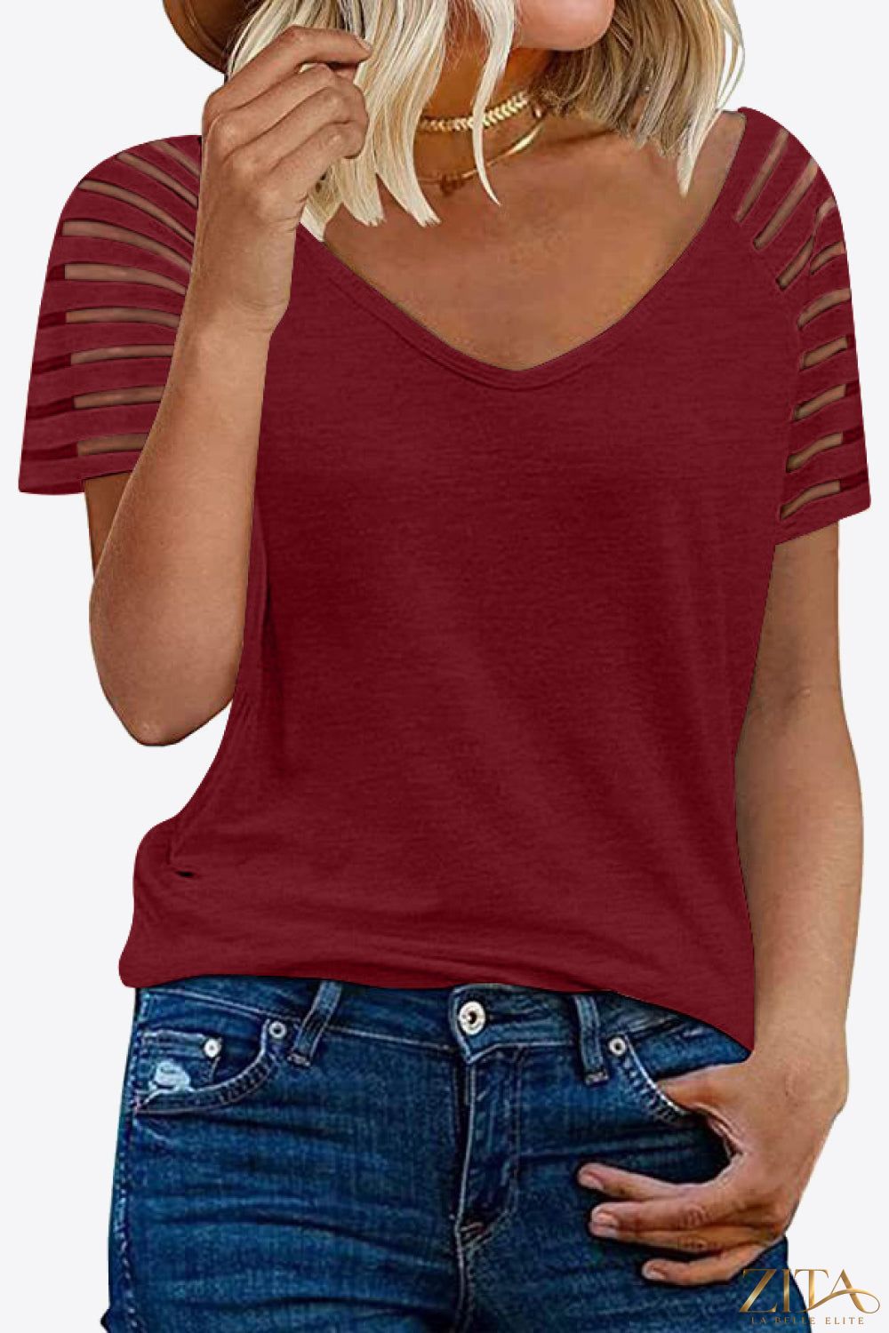 V-neck raglan sleeve tee by Trendsi featuring contrasting colored sleeves and a comfortable, casual fit.