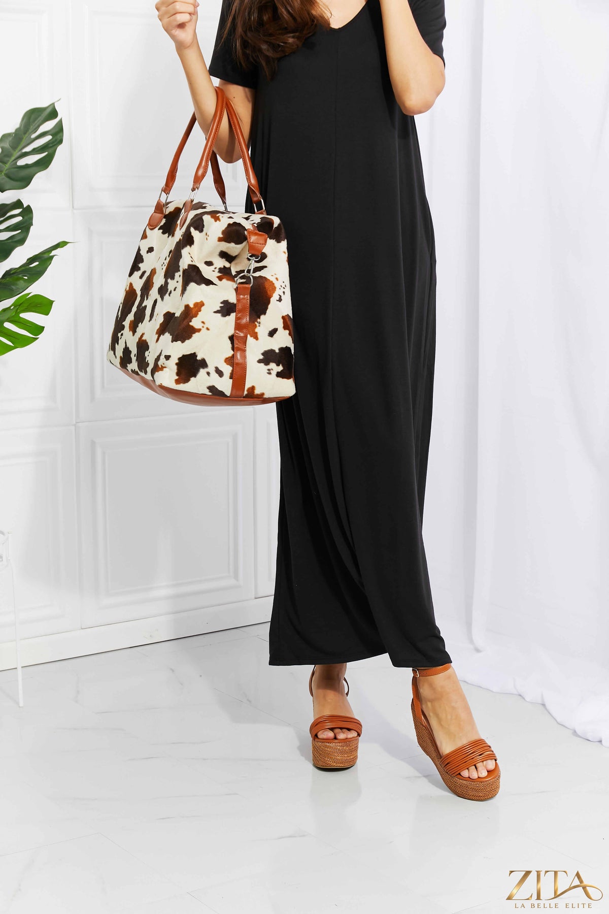 Zita La Belle Elite animal print plush weekender bag with handles and zipper closure, stylish travel accessory with leopard pattern.