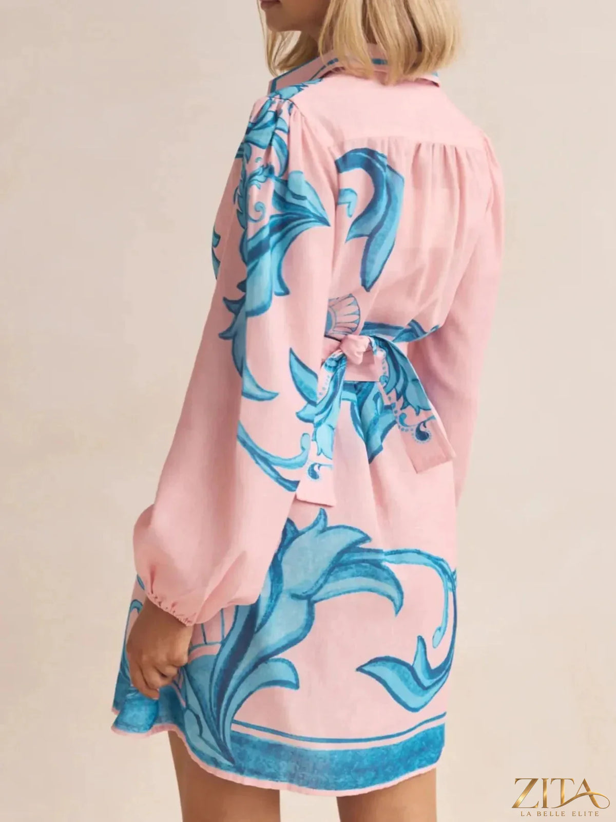 Printed long sleeve shirt dress by Trendsi featuring a stylish design and button front, perfect for casual or semi-formal wear.
