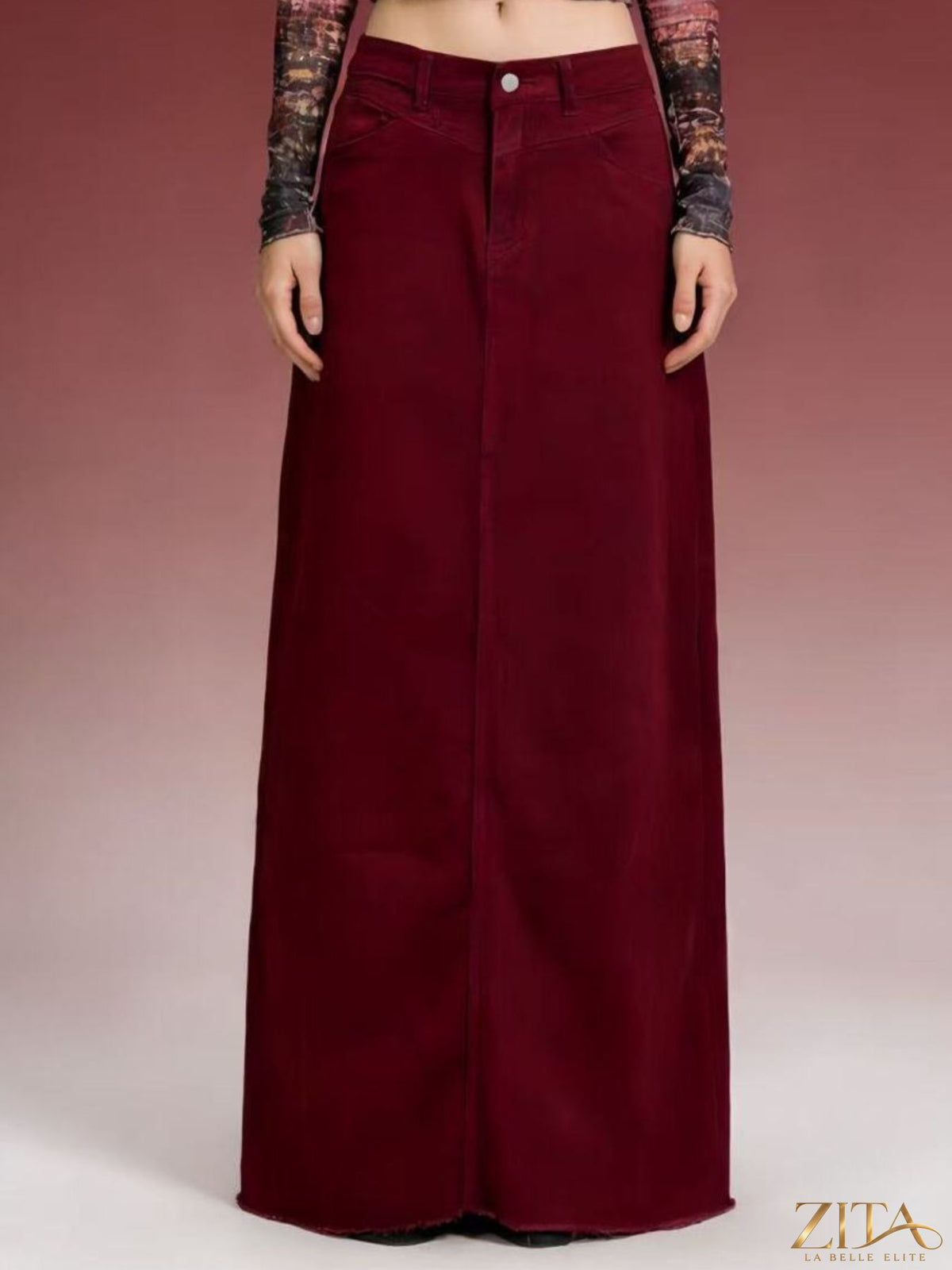 Raw hem maxi denim skirt by Zita La Belle Elite, featuring a flowing silhouette with distressed raw edges and classic blue denim fabric.
