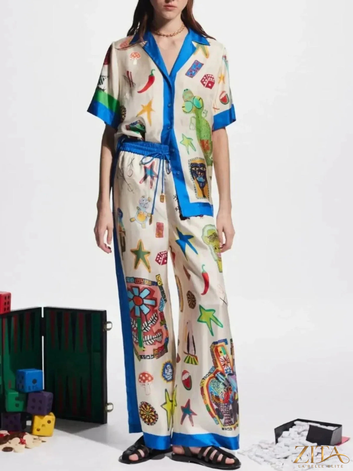 Zita La Belle Elite printed button-up shirt and matching pants set, featuring colorful floral pattern and tailored fit.