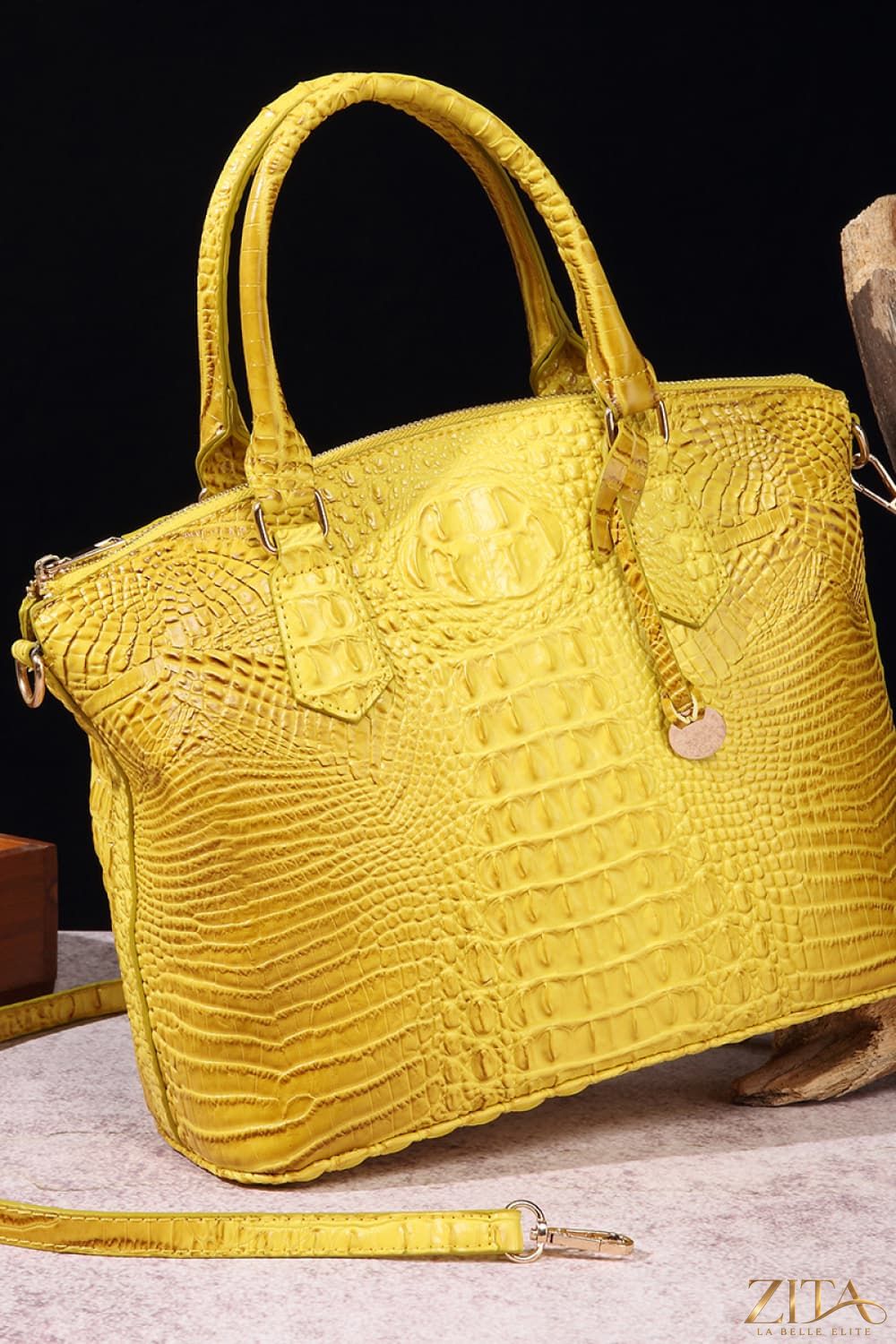 Zita La Belle Elite PU leather handbag with sleek design and top handle, featuring a smooth surface and stylish gold accents.