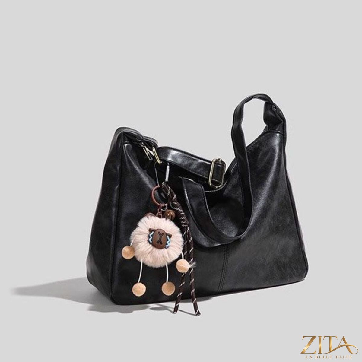 Vintage style hobo shoulder bag by Zita La Belle Elite with leather strap and rustic design, shown on a neutral background.