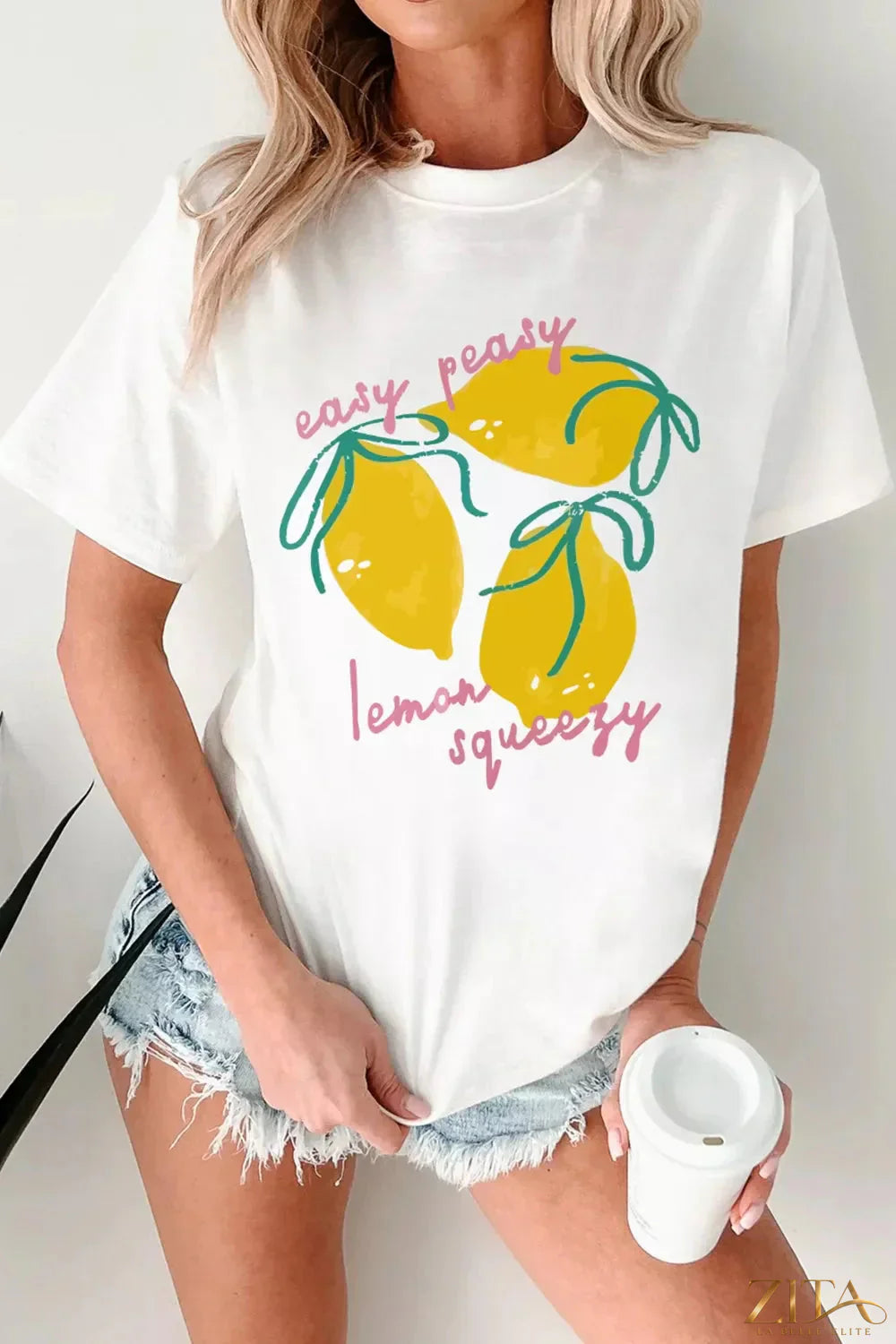 Easy Peasy Lemon Squeezy graphic T-shirt by Trendsi, featuring a bright yellow citrus print on a casual cotton tee.