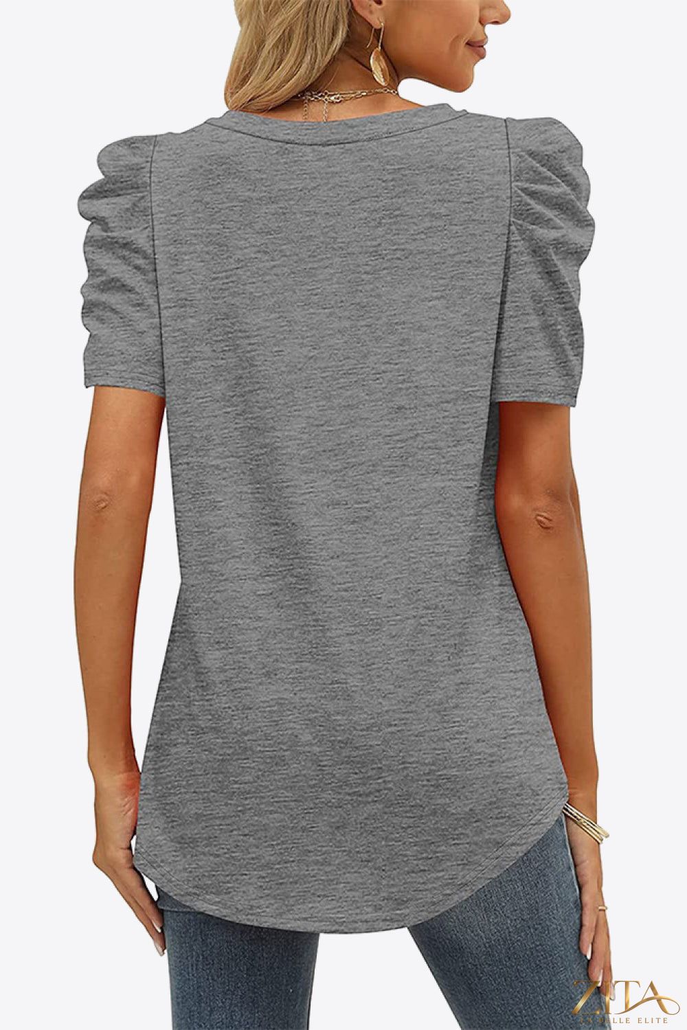 V-neck puff sleeve tee in soft fabric, featuring a relaxed fit and trendy design, by Trendsi.