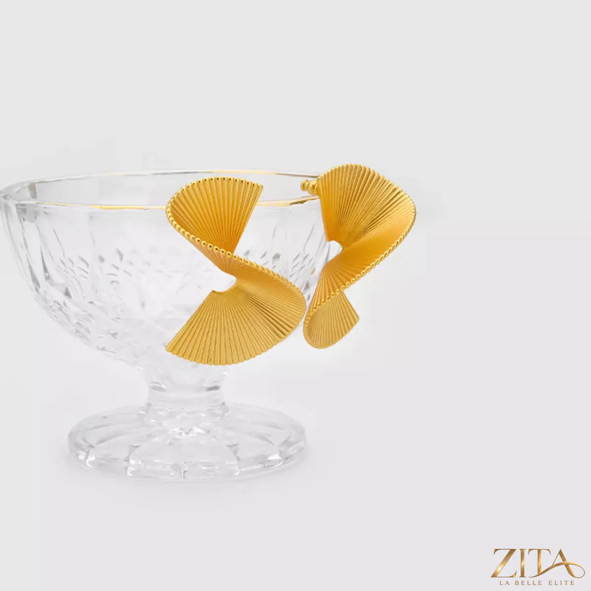 Copper fan-shaped earrings plated in 18K gold, featuring a stylish, fan-inspired design with intricate detailing.