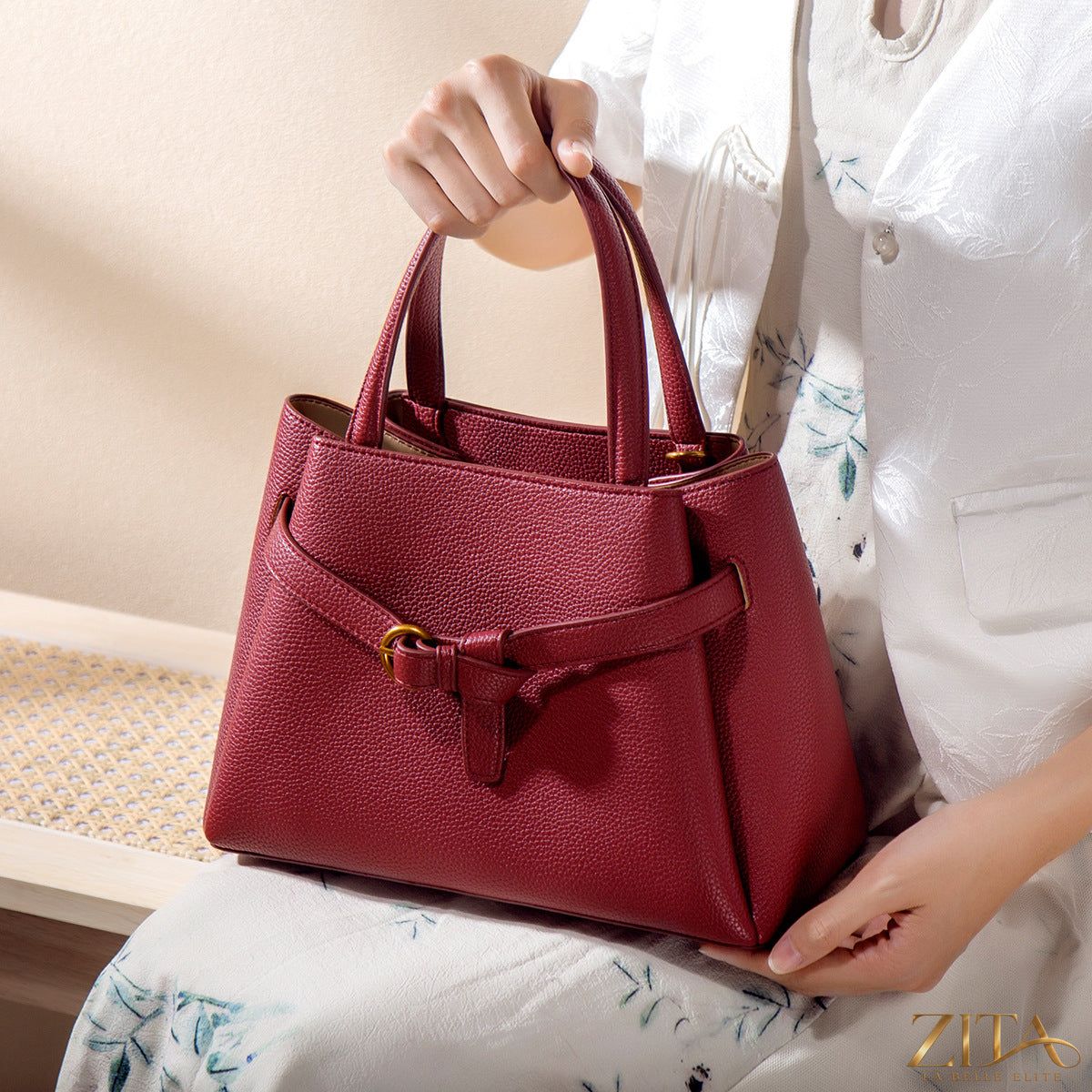 Zita La Belle Elite leather top handle handbag with sleek design, featuring a structured shape and elegant top handle in a rich leather finish.