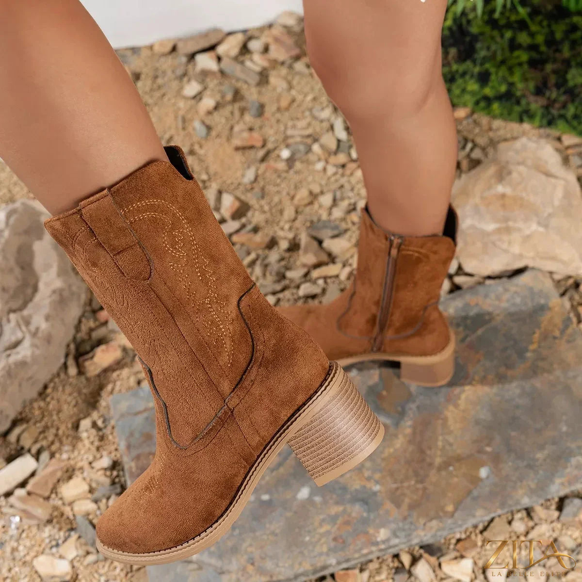 Brown suede block heel western boots with pointed toes and decorative stitching, stylish footwear from Trendsi