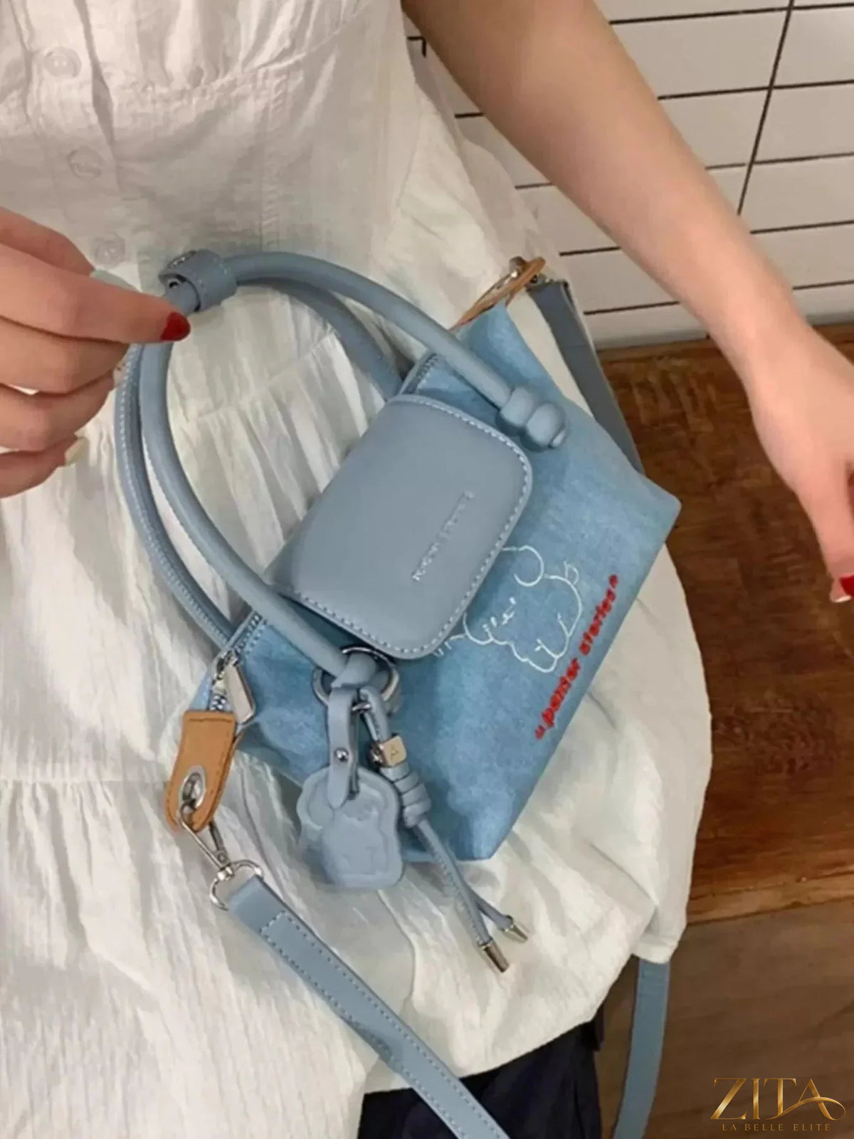 Denim handbag with embroidered puppy design by Zita La Belle Elite, featuring a casual, stylish accessory for everyday use.