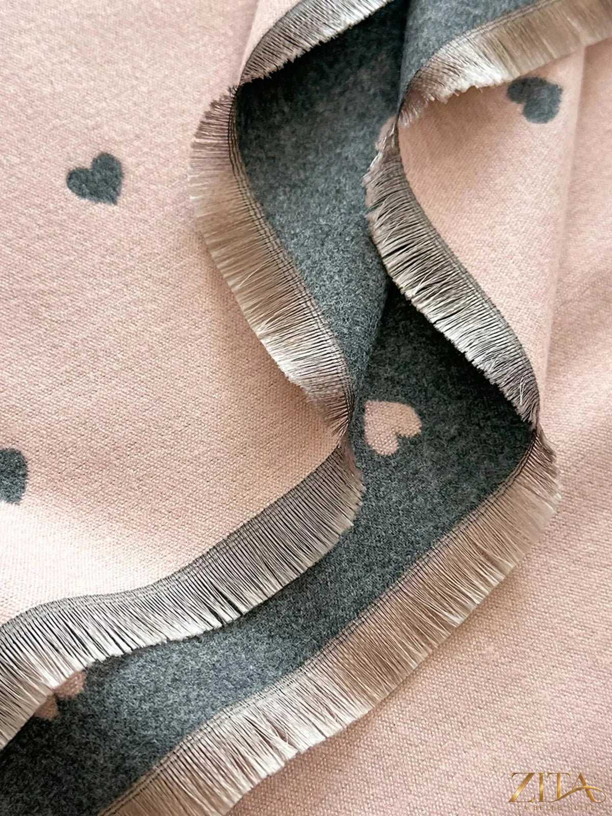 Heart raw hem scarf by Zita La Belle Elite featuring soft fabric and raw edge details, displayed flat on a neutral background.