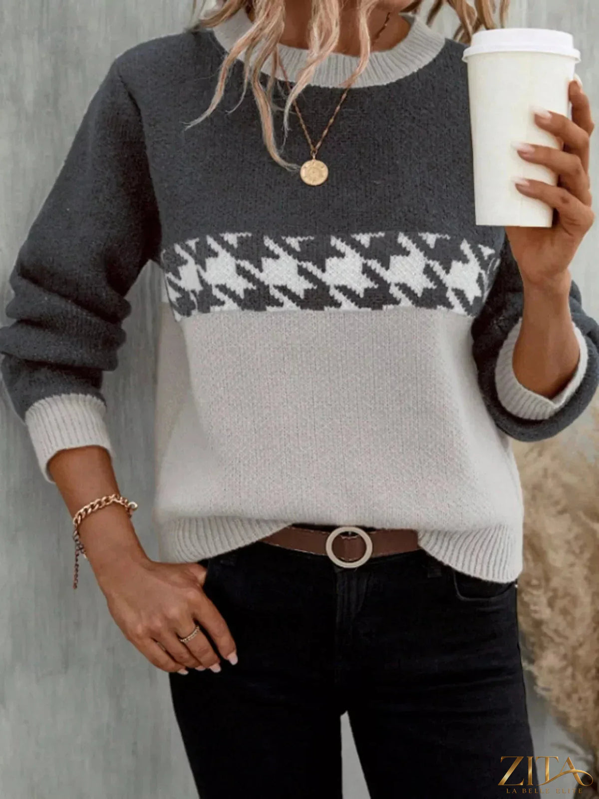 Color block houndstooth sweater by Trendsi featuring a stylish black and white pattern, long sleeves, and cozy knit fabric.