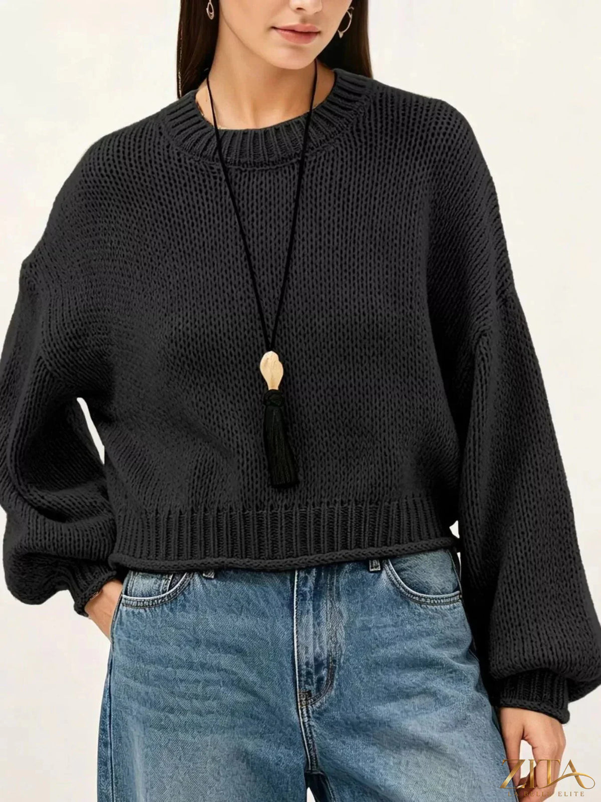 Oversized chunky knit sweater from Trendsi featuring a cozy, textured knit in neutral tones, perfect for casual winter wear.