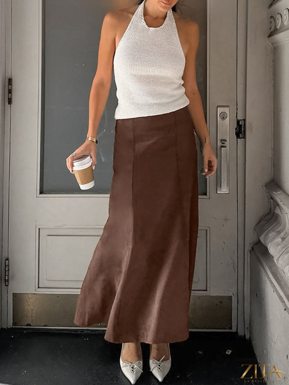Trendsi suede midi skirt in soft brown with a high waist and flowy silhouette, shown on a model against a neutral background.