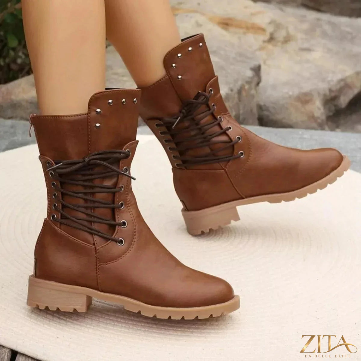 Black studded lace-up boots by Trendsi featuring metal studs, chunky heels, and leather-like material for a bold, edgy look.