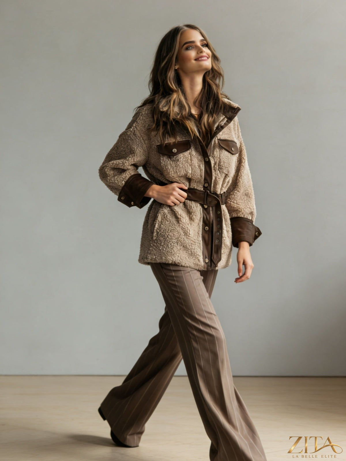Women’s vintage PU leather jacket with lamb fur lining, stylish autumn winter coat from Zita La Belle Elite, shown on model.