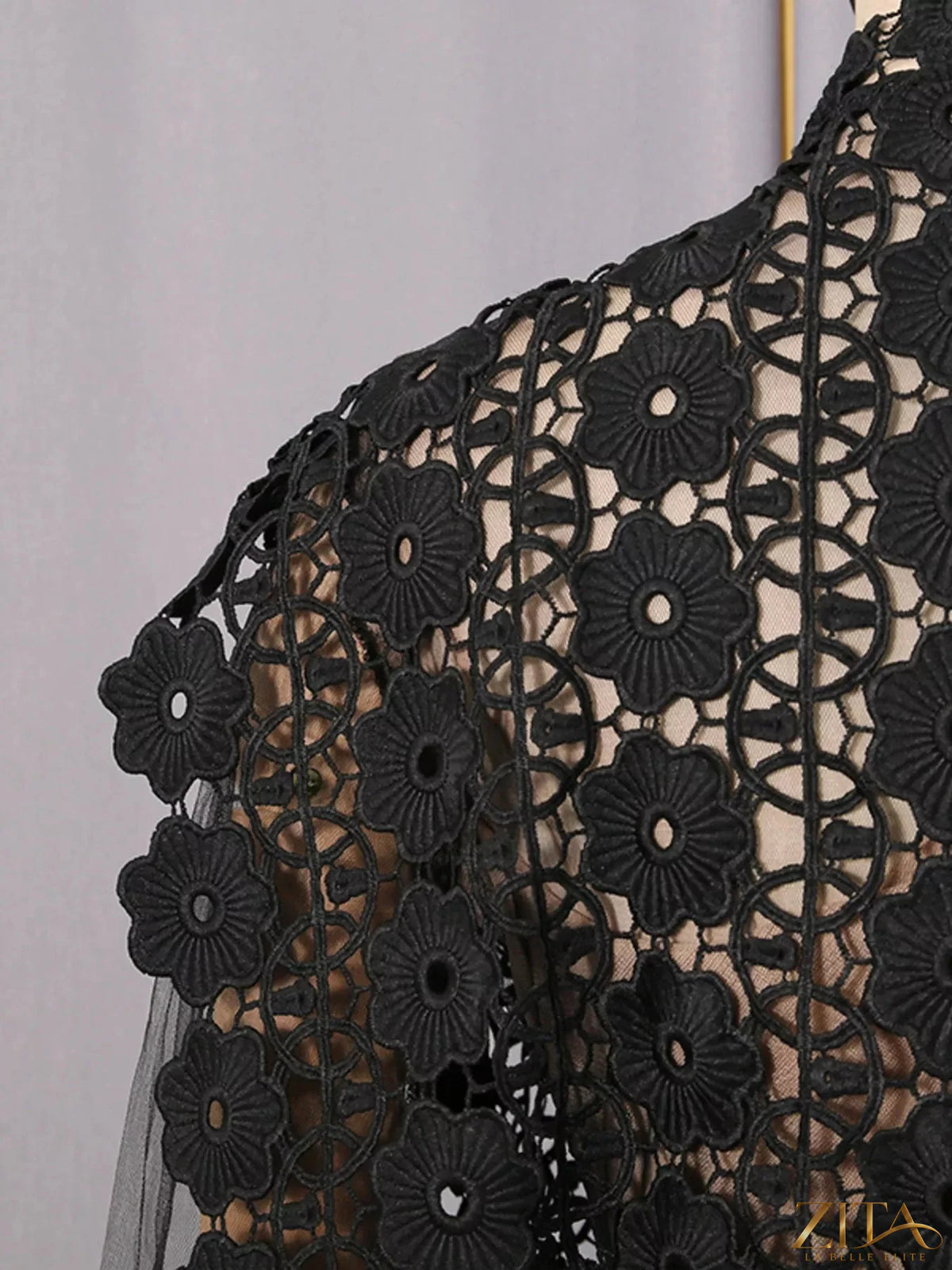 Lace sheer sleeve mini dress from Trendsi featuring delicate lace fabric and long sheer sleeves, perfect for elegant occasions.