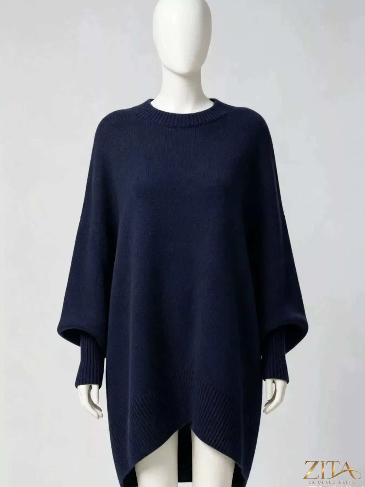 Oversized dropped shoulder sweater by Trendsi, soft knit fabric with a relaxed fit and long sleeves, displayed on a mannequin.