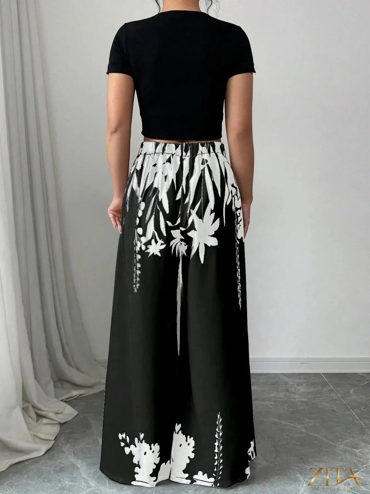 Printed wide-leg pants by Zita La Belle Elite featuring a flowy silhouette and vibrant patterns, perfect for stylish casual wear.