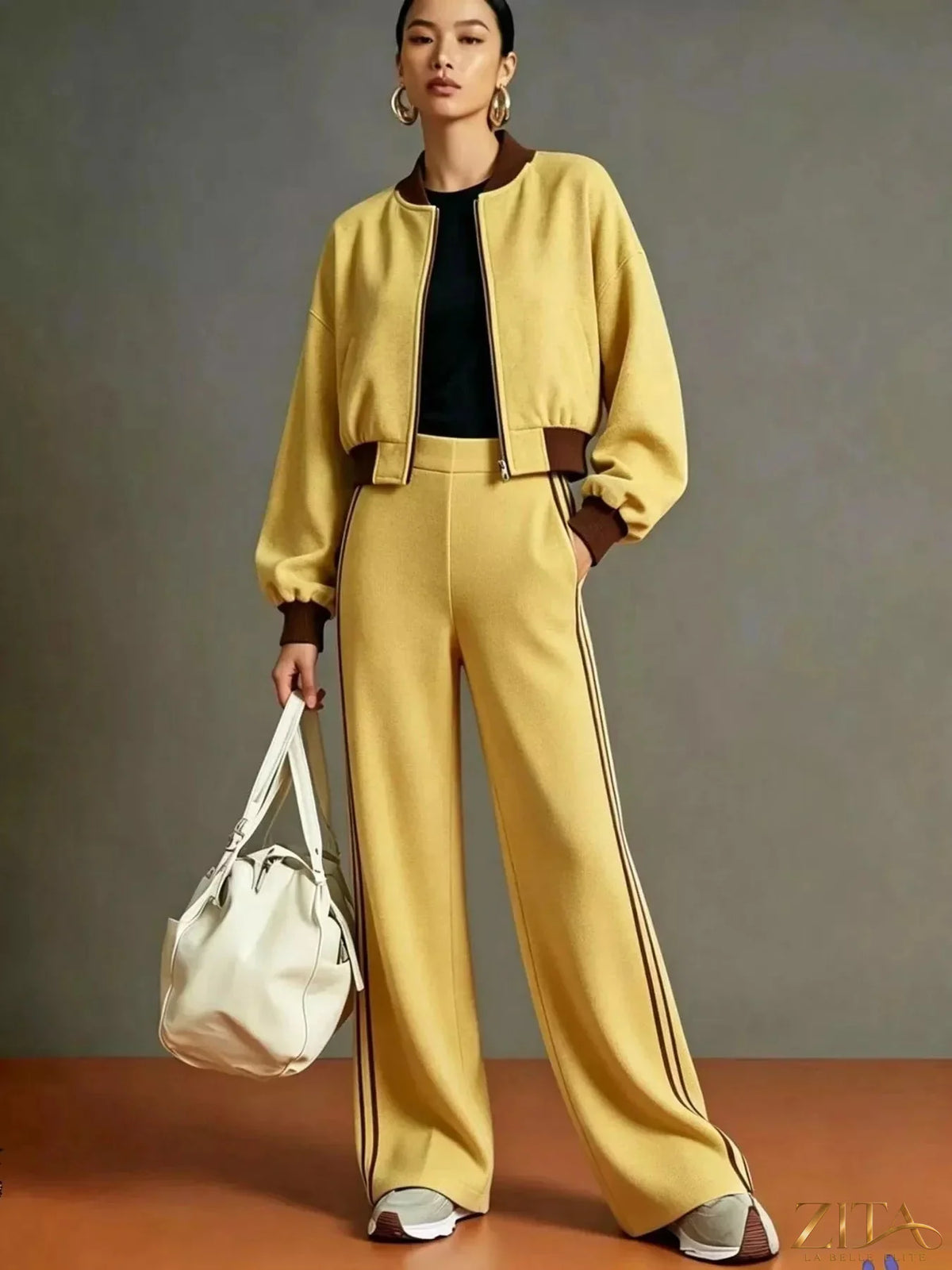 Contrast ribbed jacket and wide-leg pants tracksuit set by Zita La Belle Elite, featuring stylish ribbed fabric and relaxed fit.