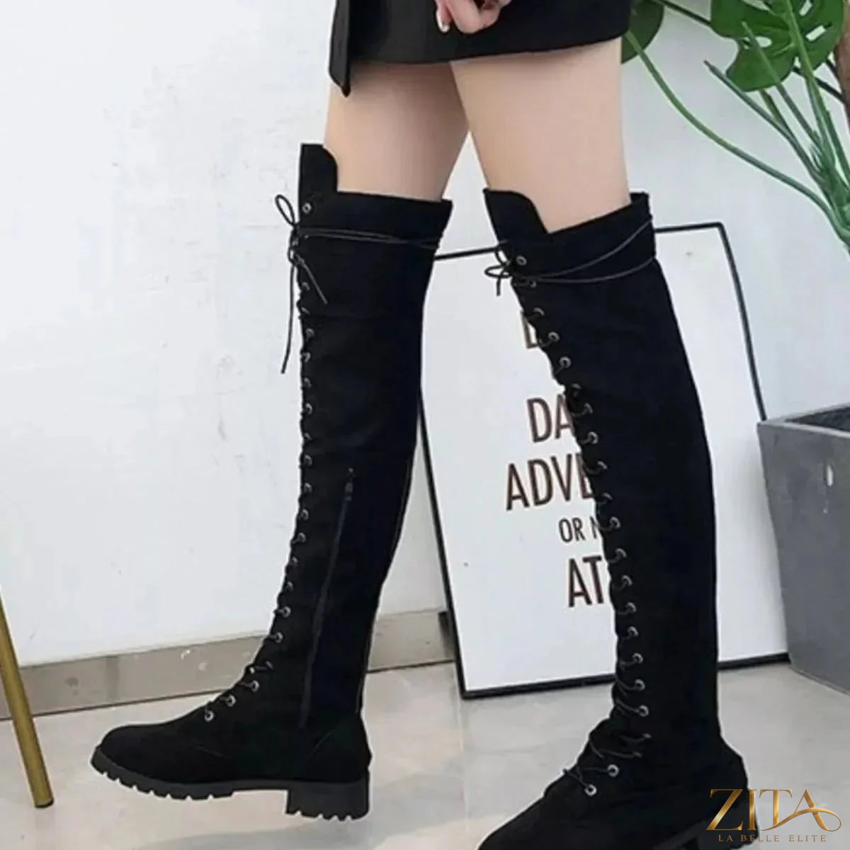Black lace-up over-the-knee boots from Trendsi, featuring a sleek design and chunky heel, ideal for stylish fall and winter outfits.