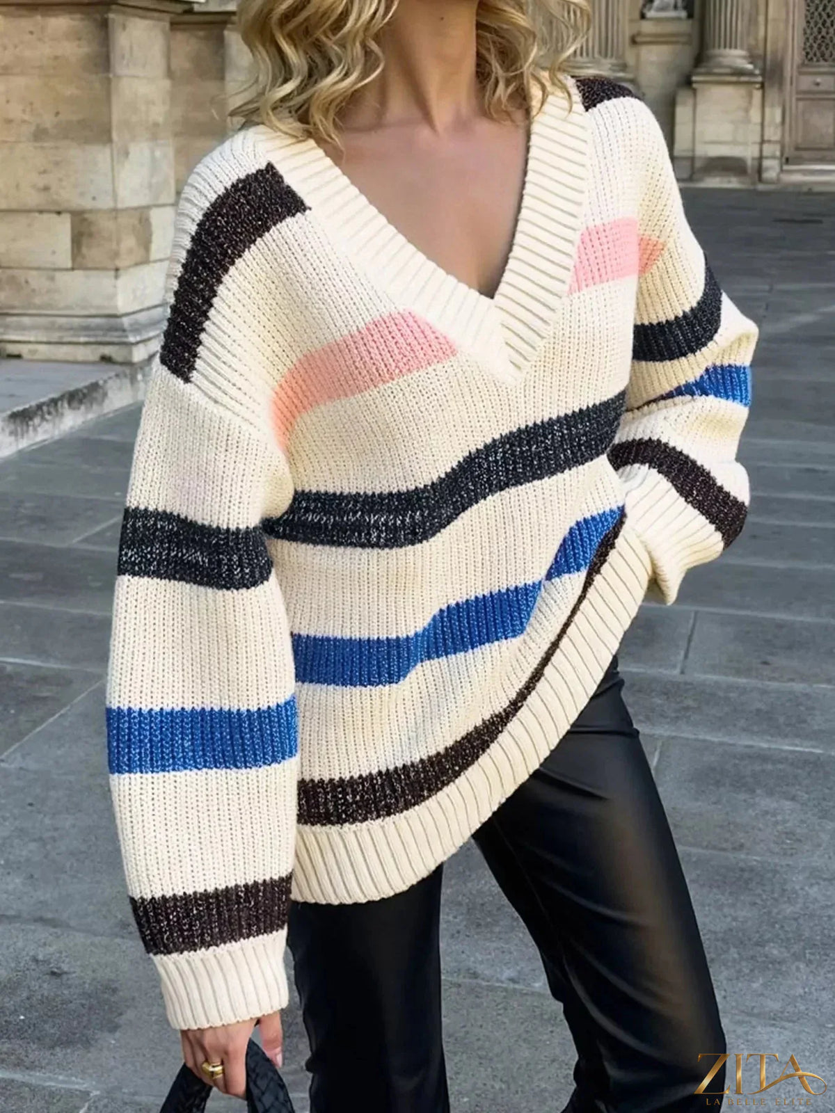 Striped V-neck oversized sweater by Trendsi, featuring bold horizontal stripes and a relaxed fit, perfect for casual wear.