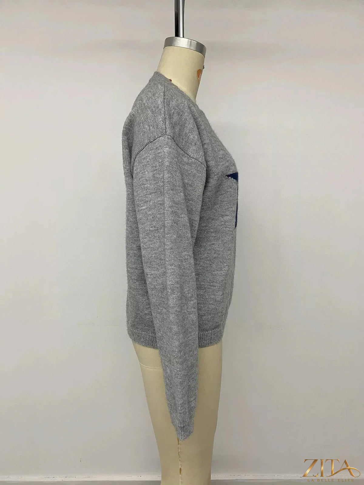 Star-patterned dropped shoulder sweater by Zita La Belle Elite, featuring a cozy knit with celestial star designs.