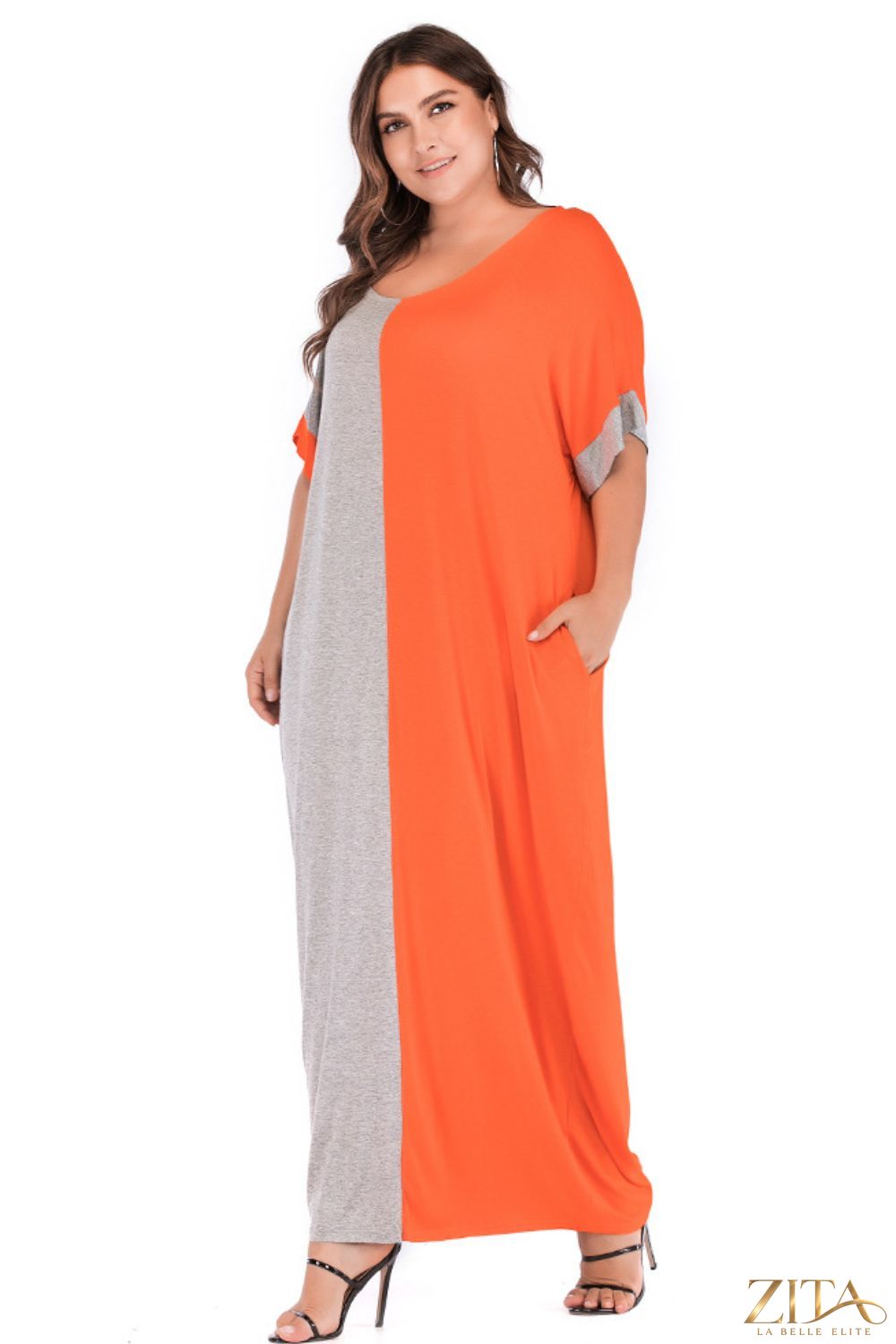 Plus size color block tee dress with pockets by Trendsi, featuring a casual silhouette and vibrant color blocking design.