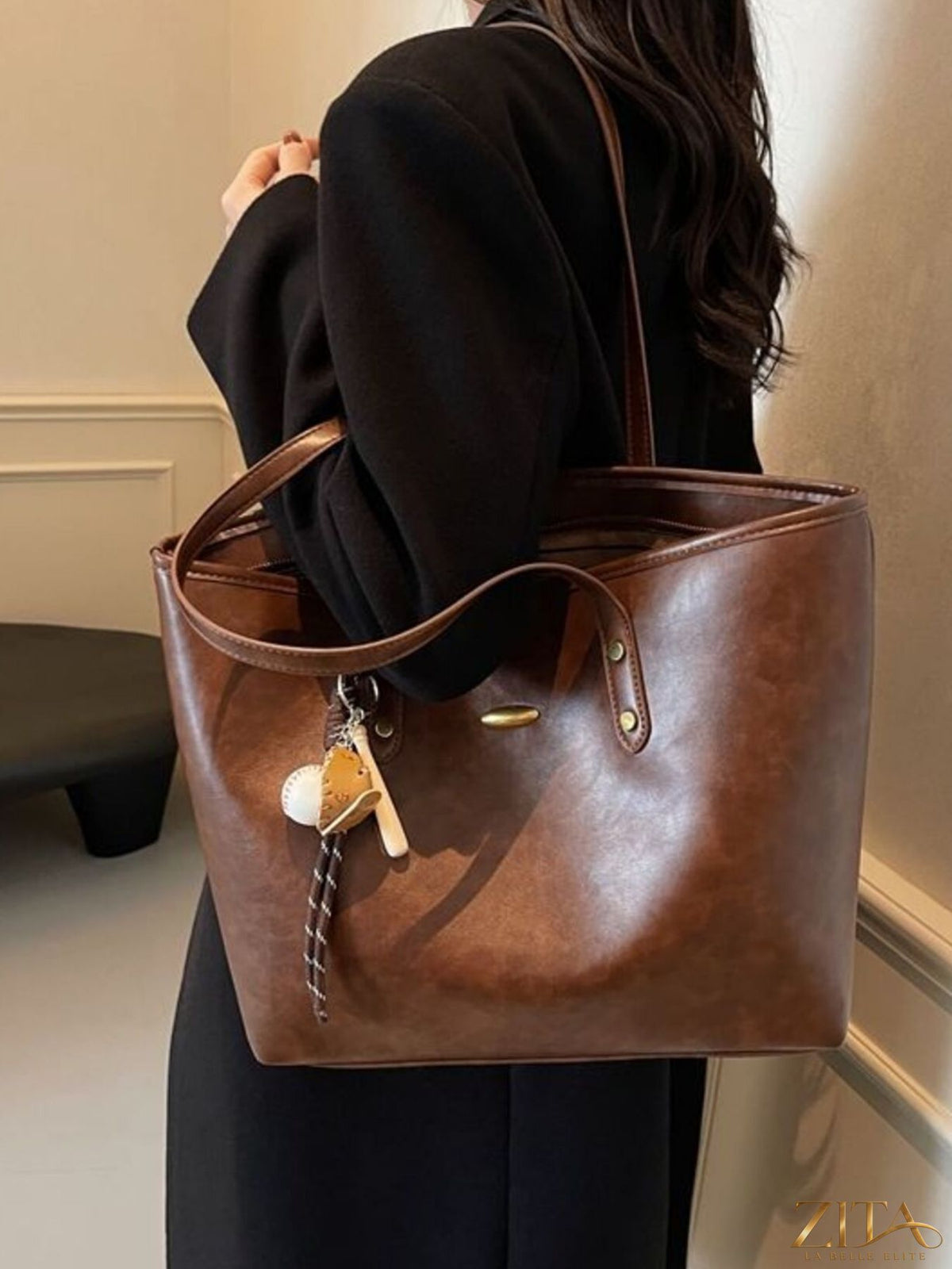 Vintage style leather tote bag by Zita La Belle Elite with sturdy handles and classic design, shown on a plain background.