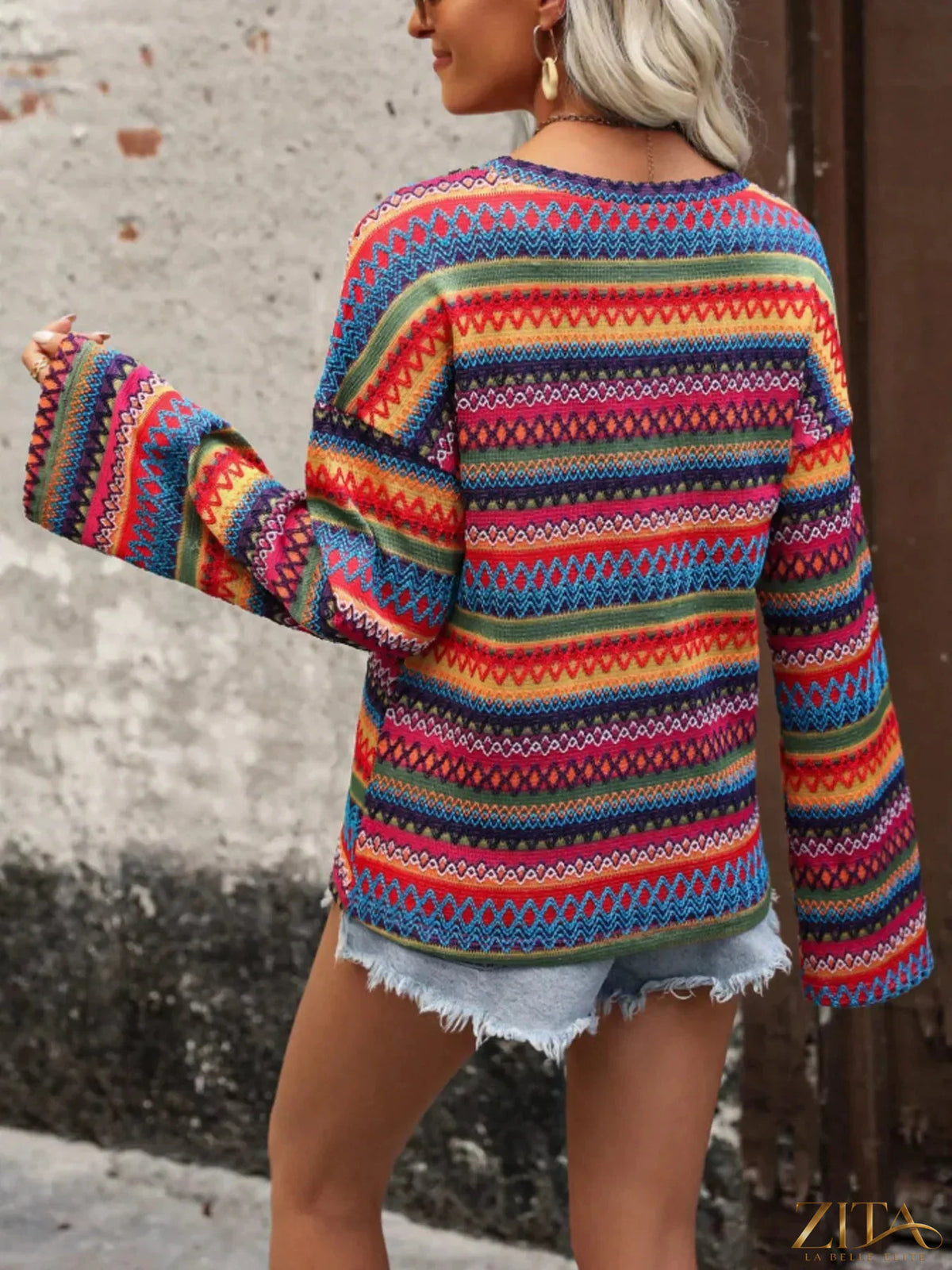Zita La Belle Elite vibrant multi-color geometric pattern knit top, featuring bold shapes and a fitted design.
