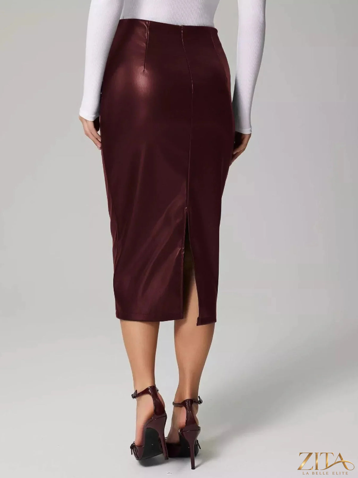 Zita La Belle Elite slit back leather skirt shown on a model, featuring a sleek black design with a stylish slit at the back.