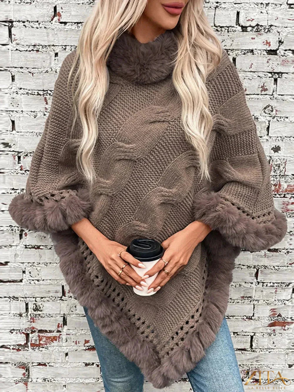 Fuzzy hem cable-knit poncho by Trendsi featuring a cozy, textured knit with a relaxed fit and stylish design.