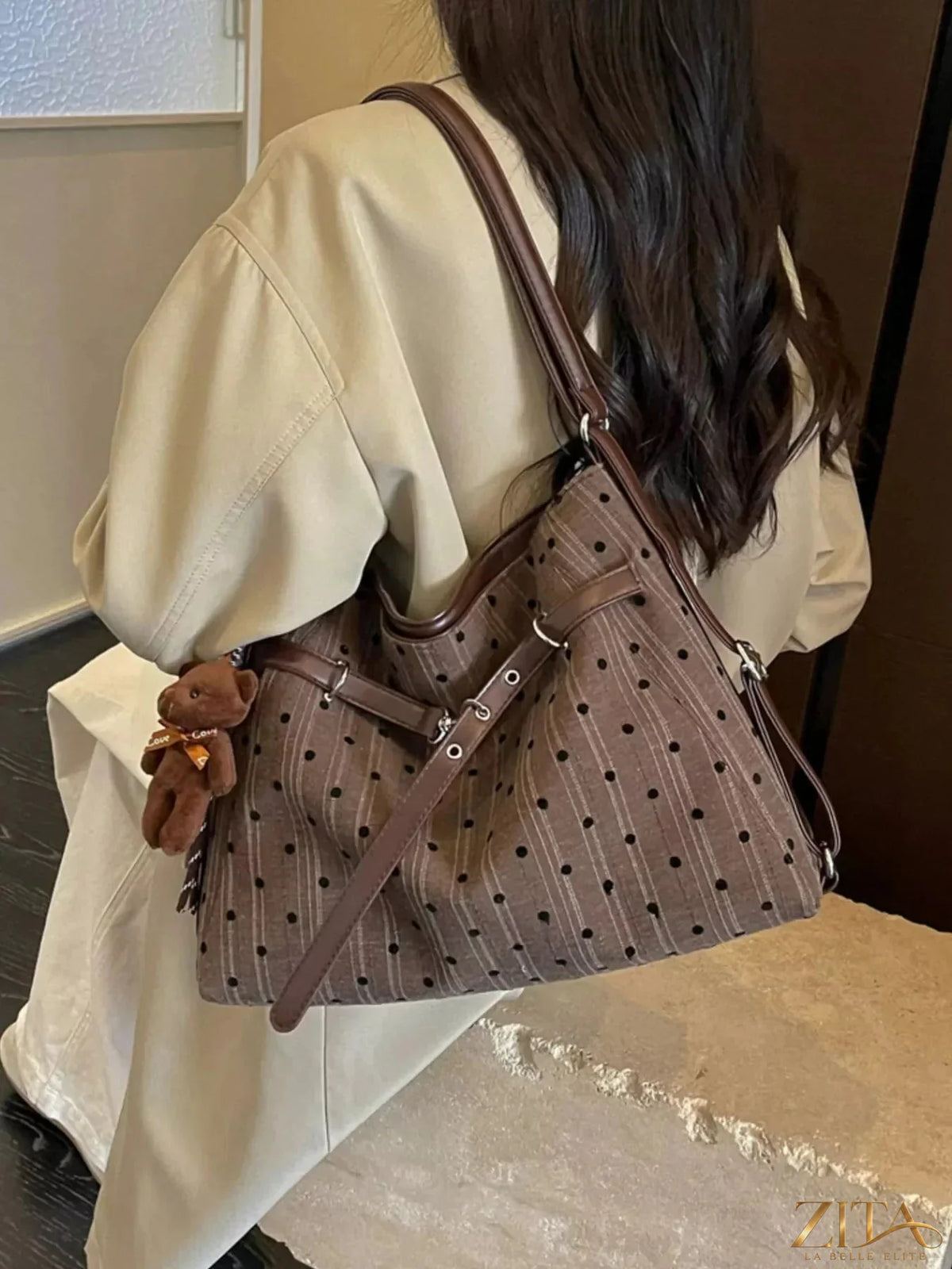 Polka dot shoulder bag by Zita La Belle Elite, featuring a stylish design with a shoulder strap and polka dot pattern.