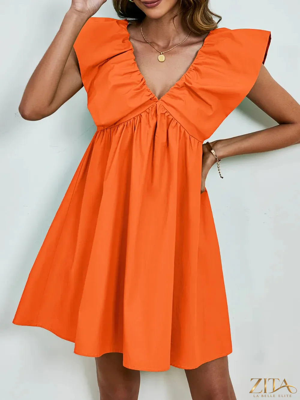 Zita La Belle Elite V-neck cap sleeve mini dress in black, fitted style with a sleek V-neckline and short cap sleeves.