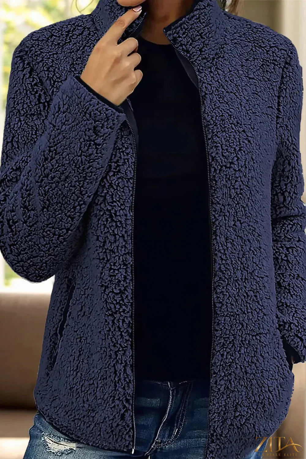 Trendsi pocketed zip-up turtleneck jacket featuring a cozy fit, front pockets, and a stylish high collar in black.