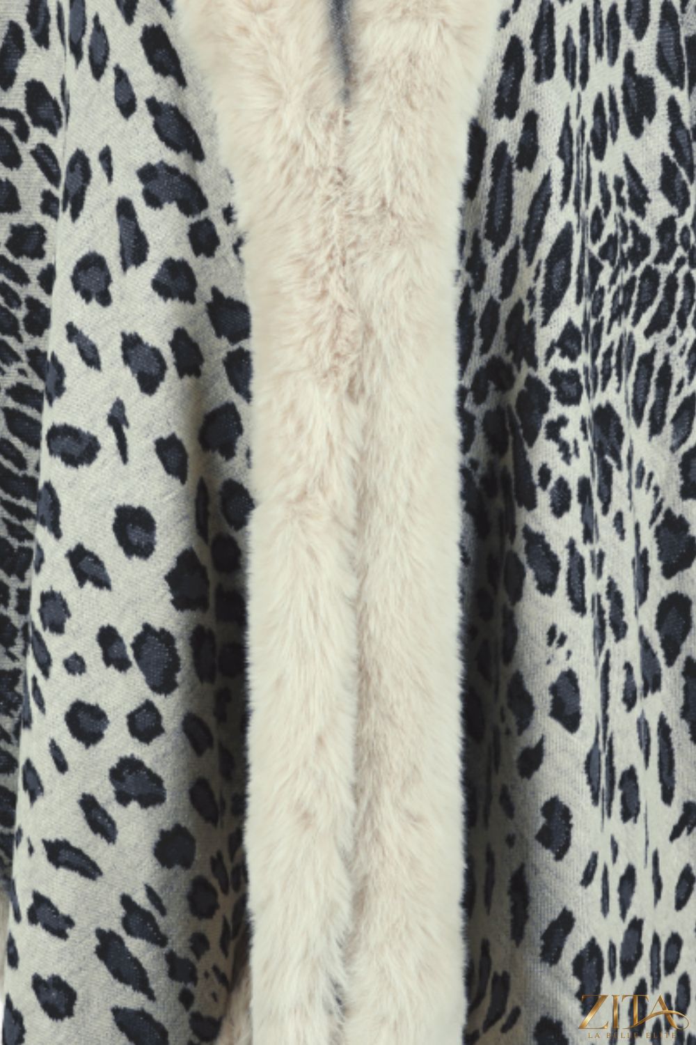 Leopard print open front poncho by Trendsi, lightweight with a flowing design, perfect for layered fall or winter outfits.