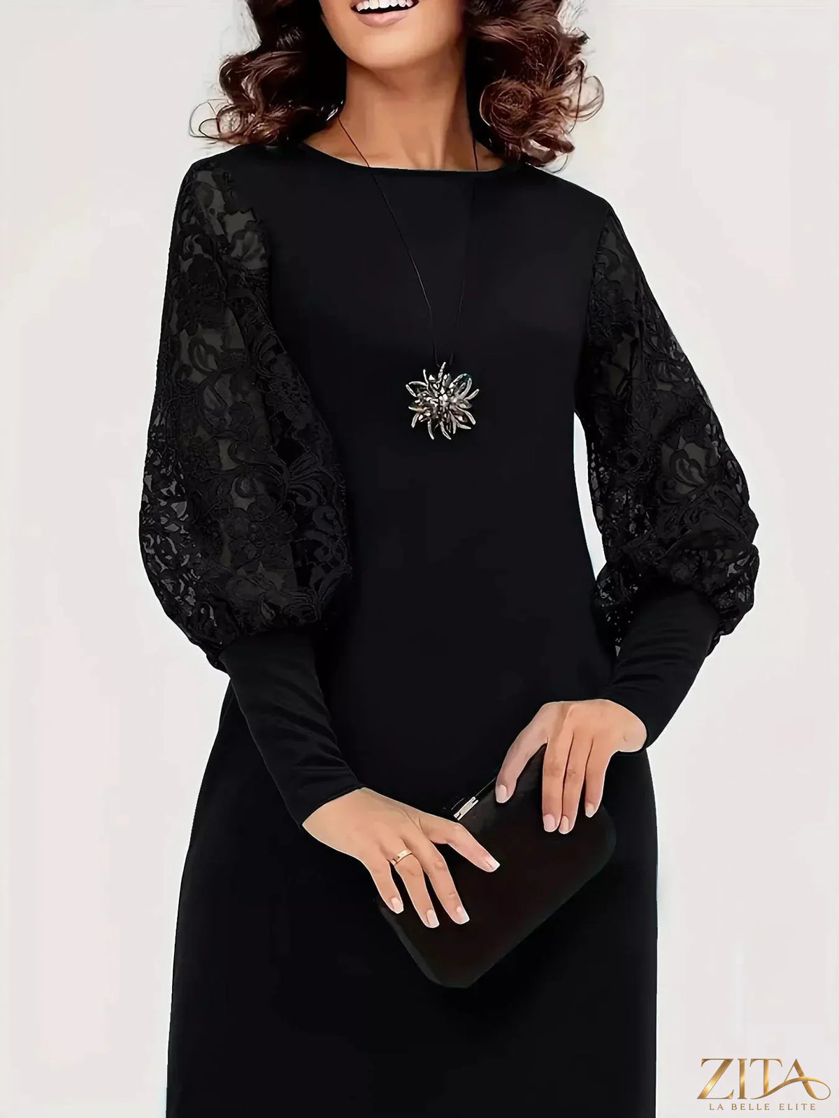 Lace lantern sleeve dress by Trendsi featuring elegant lace details and a flowing silhouette in a stylish design.