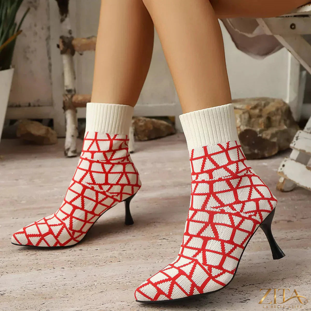 Point toe flared heel boots by Zita La Belle Elite, showcasing sleek black leather with a stylish pointed toe and flared heel design.