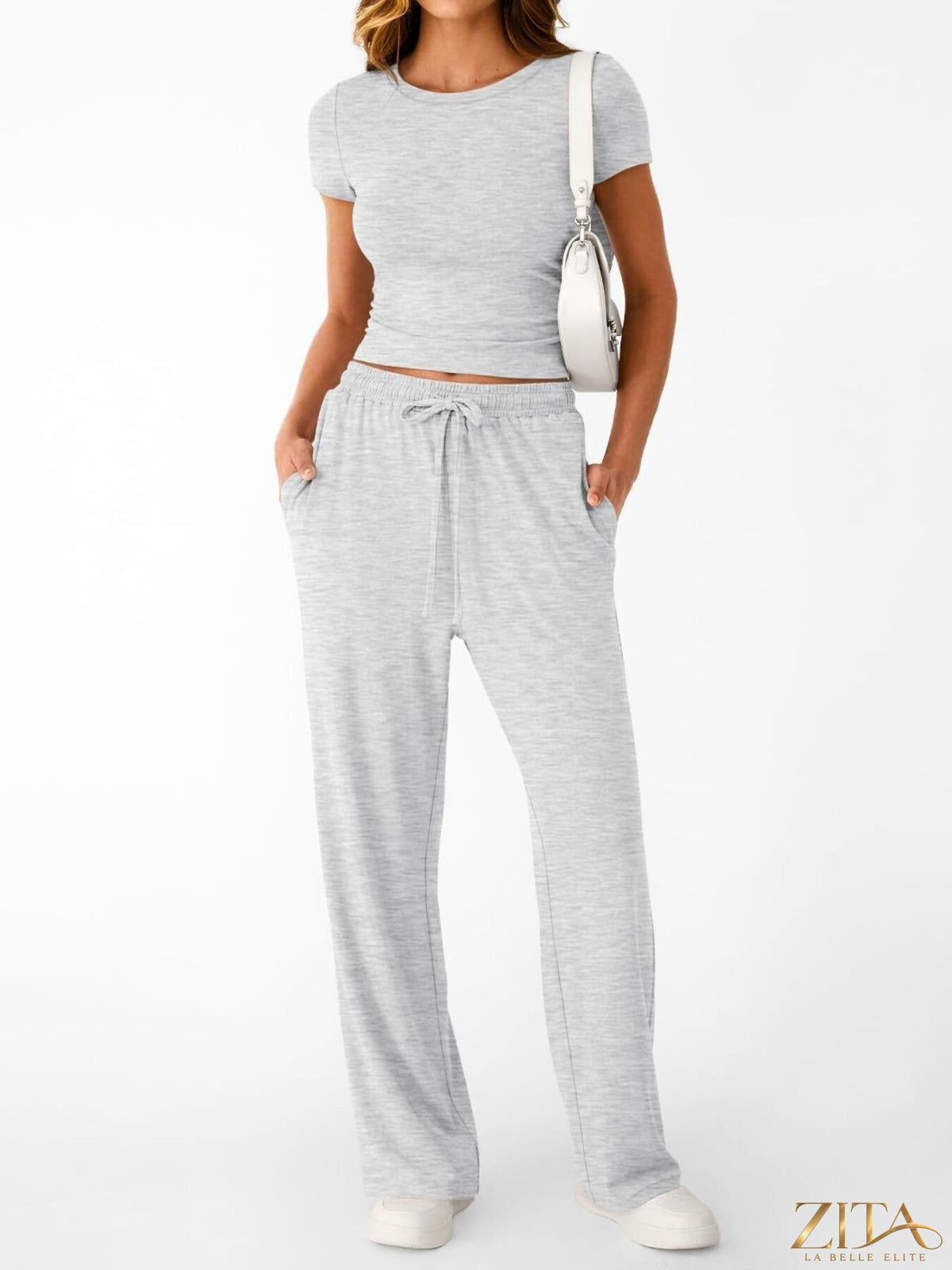 Trendsi round neck short sleeve tee and matching pants set, casual outfit for women, shown in a comfortable, stylish look.