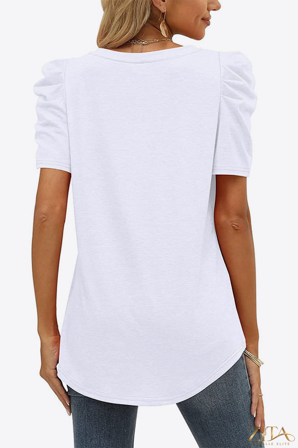 V-neck puff sleeve tee by Trendsi, featuring a fitted silhouette with lightweight fabric and stylish puffed sleeves.