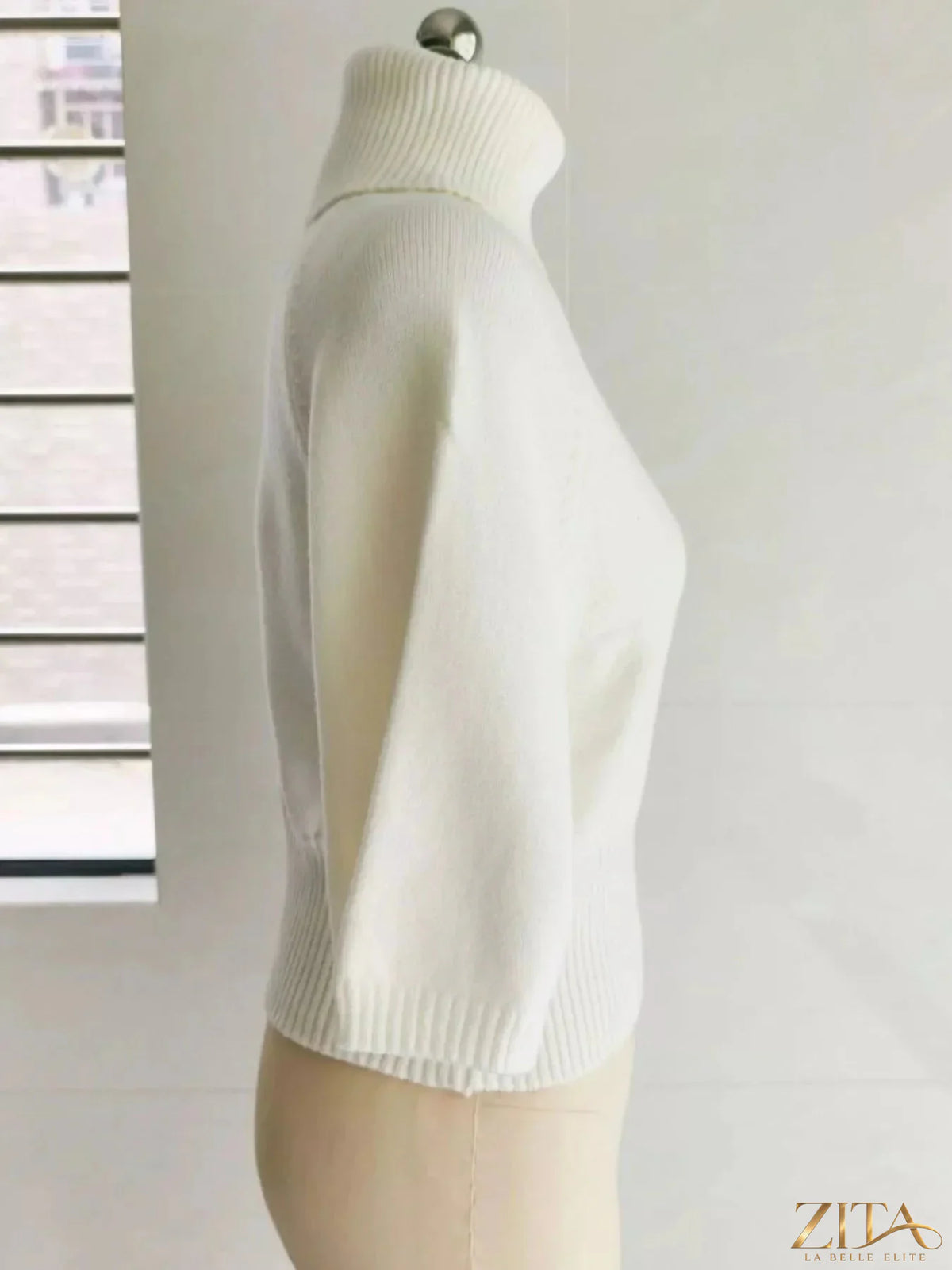 Black turtleneck batwing sleeve sweater by Trendsi, featuring a cozy, fitted design and flowy, dramatic sleeves.