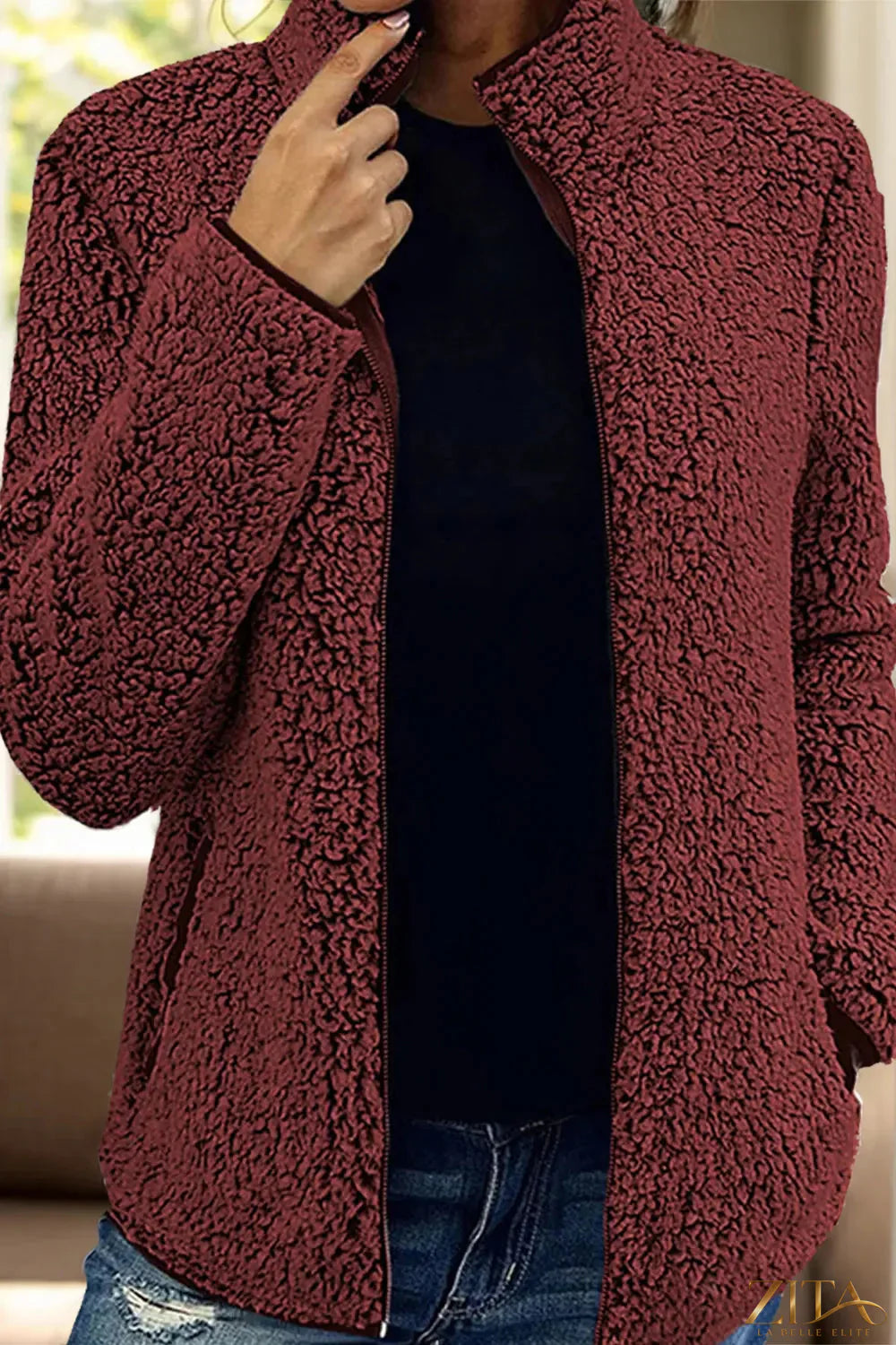 Trendsi pocketed zip-up turtleneck jacket in black, featuring a fitted design, front pockets, and a high collar for warmth and style.