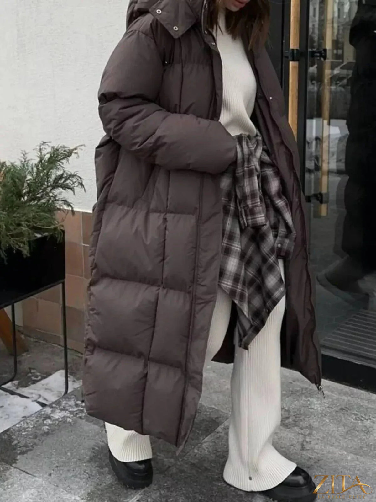 Longline padded winter coat with belt from Zita La Belle Elite, featuring a structured silhouette and warm, insulated design.