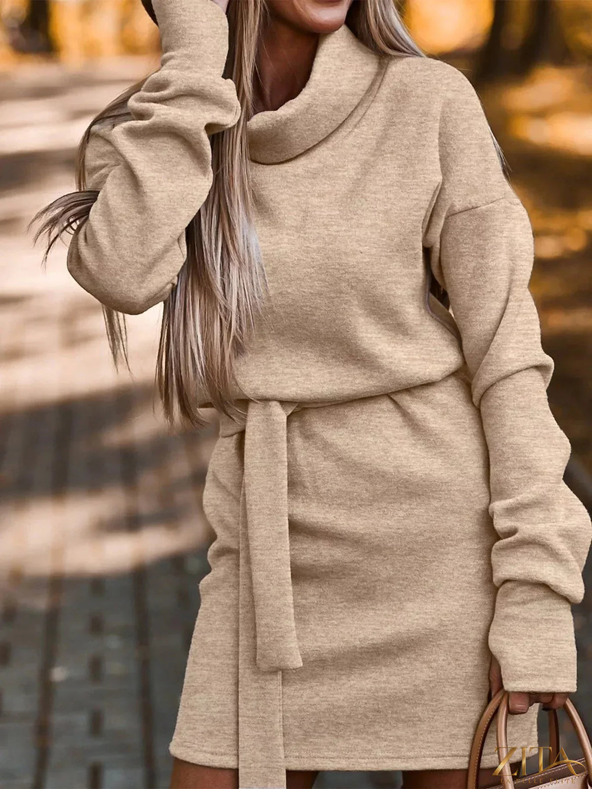 Zita La Belle Elite belted knit turtleneck dress in cozy, fitted style with a waist belt and ribbed texture.