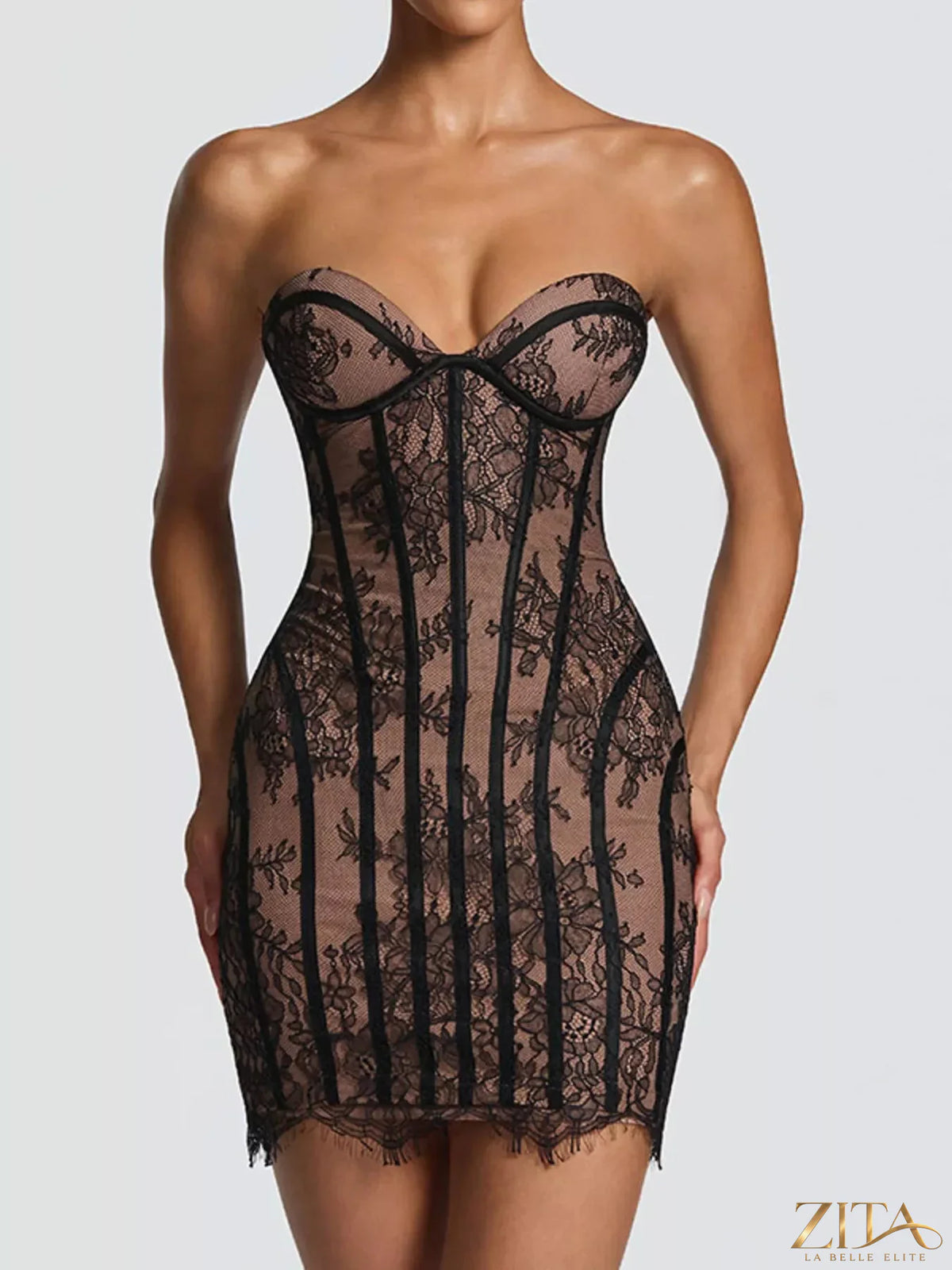 Lace detail tube mini dress by Trendsi featuring a fitted silhouette and elegant lace accents, perfect for stylish occasions.