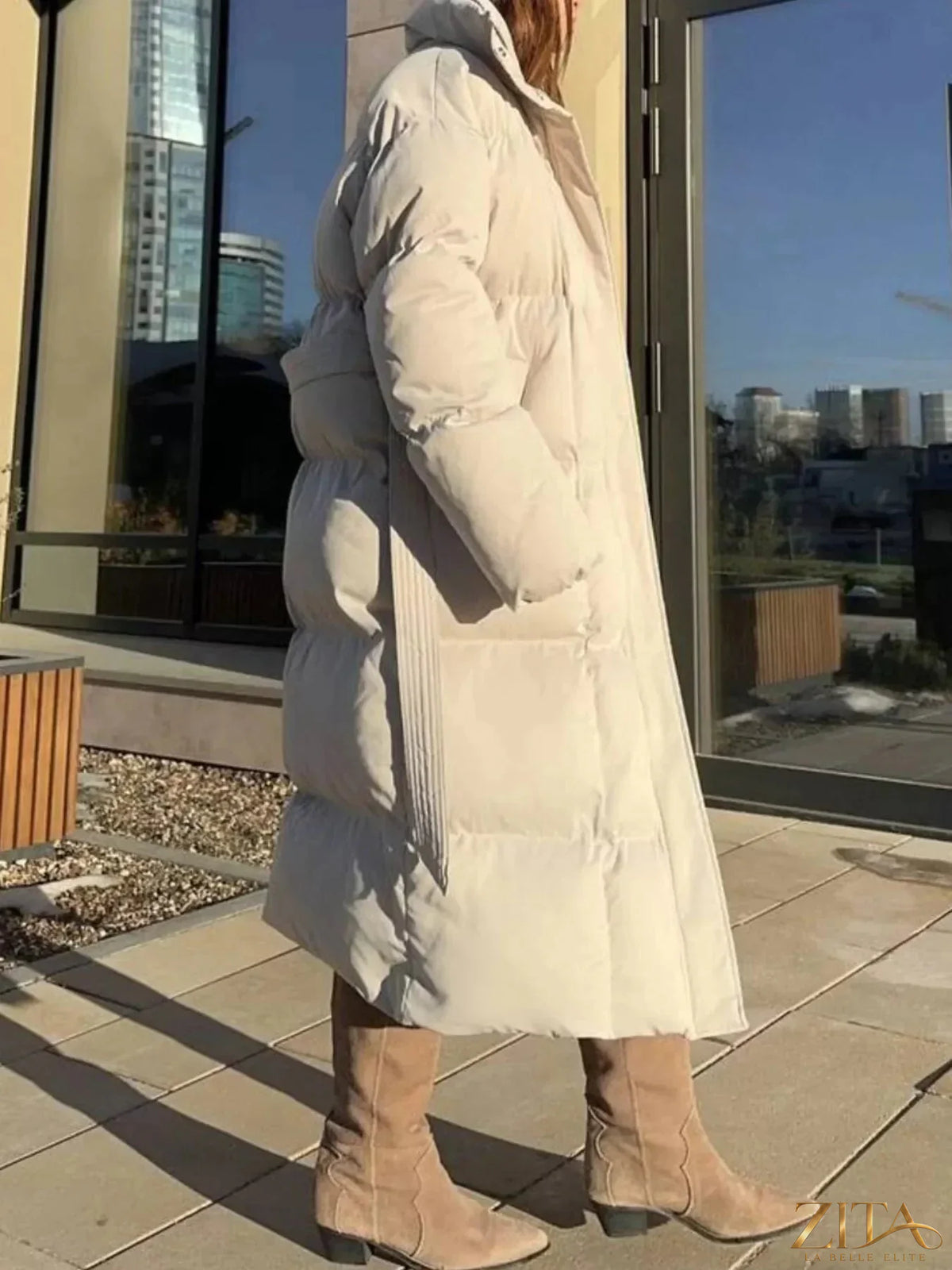 Longline padded winter coat with belt from Zita La Belle Elite, featuring a warm, insulated design and a stylish, tailored fit.