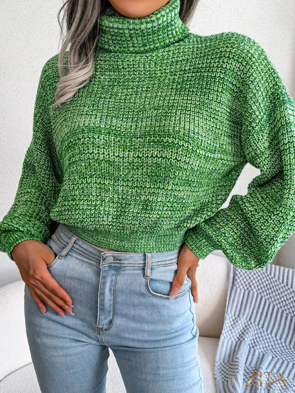 Cream-colored turtleneck dropped shoulder sweater by Trendsi, featuring a cozy fit and relaxed style in a close-up image.