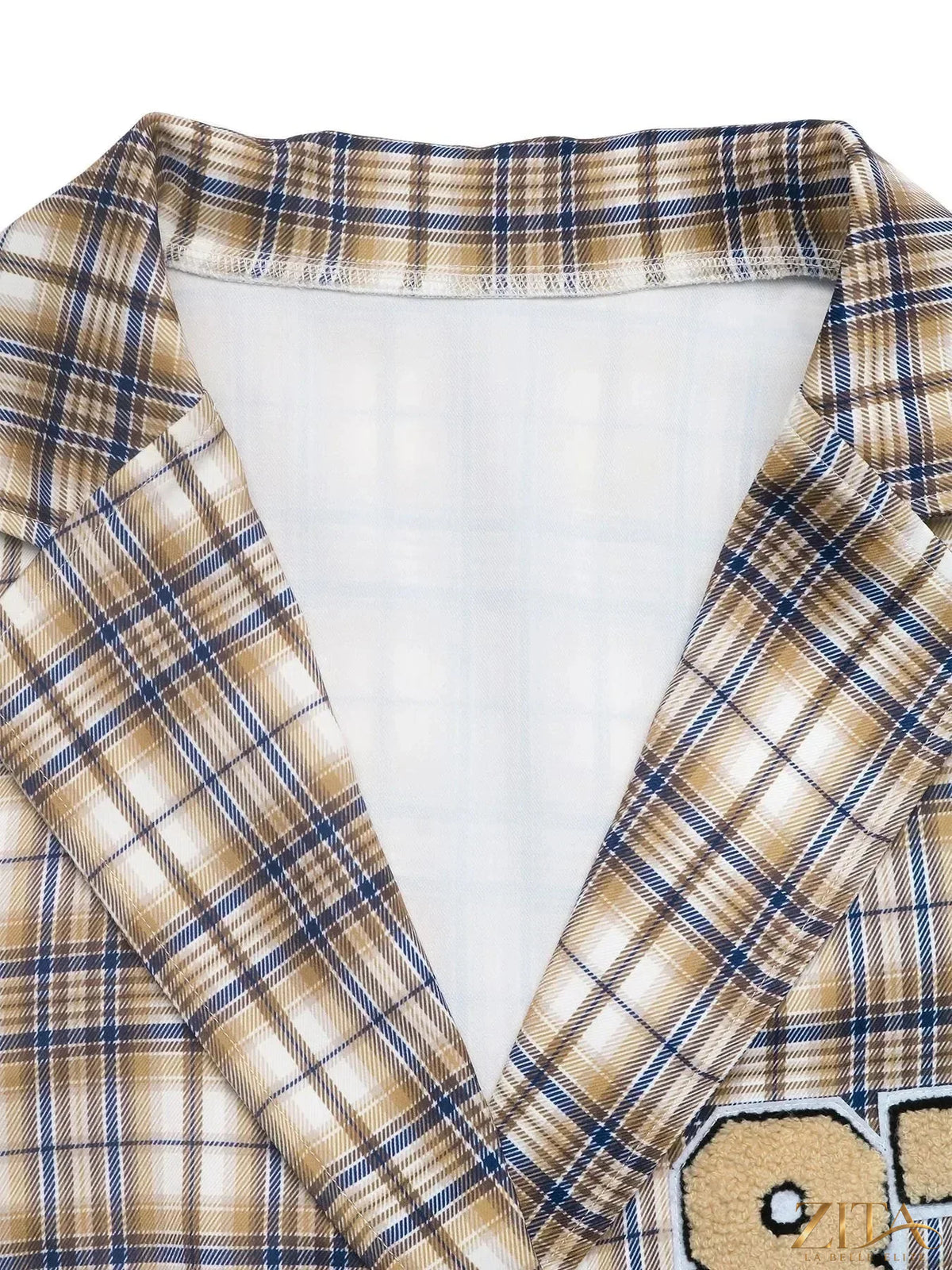 Zita La Belle Elite Number 87 plaid long sleeve blazer with tailored fit and classic design, displayed on a hanger.