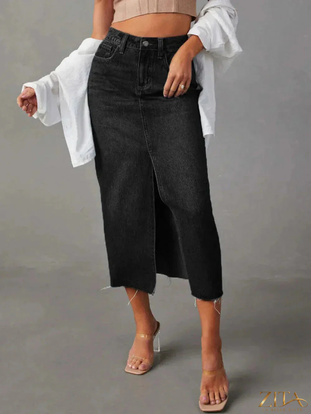 Zita La Belle Elite raw hem front slit denim midi skirt showing distressed hem and front slit detail on a model.