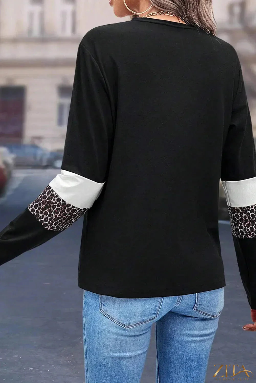 Leopard print round neck long sleeve blouse by Zita La Belle Elite, showcasing a stylish fit and bold animal pattern.