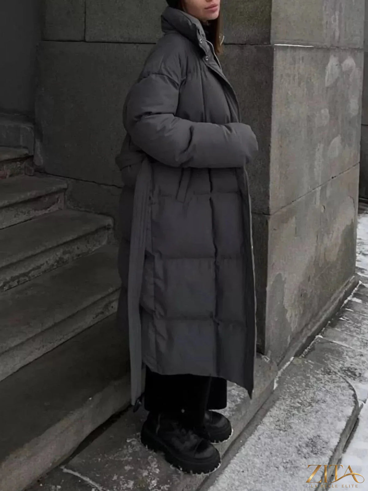 Longline padded winter coat with belt from Zita La Belle Elite, featuring a sleek design and warm insulated fabric.